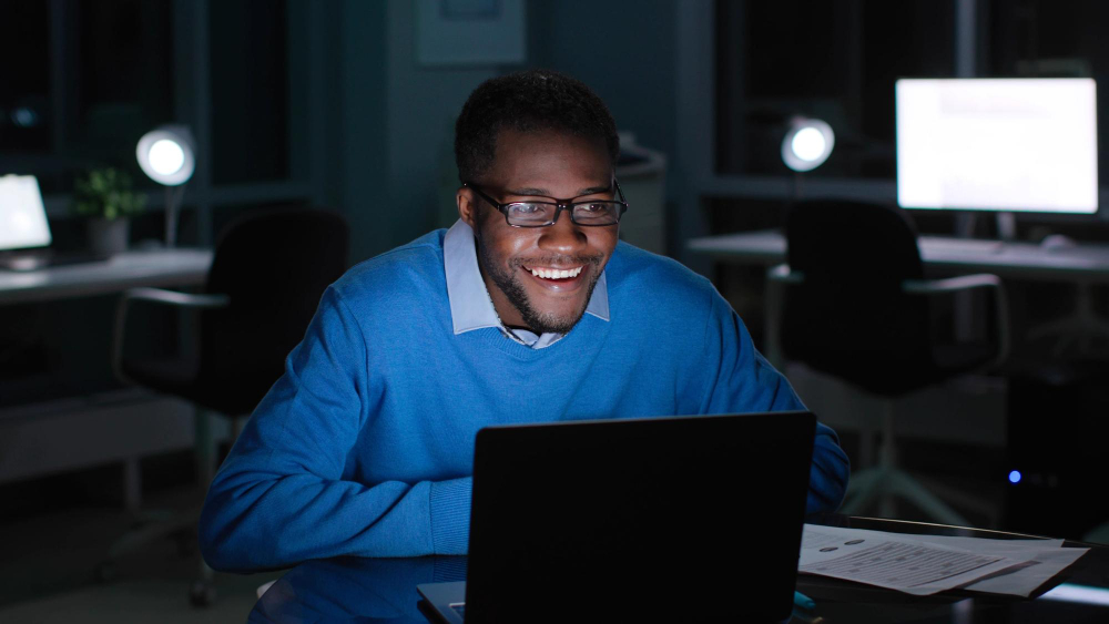 Technology professional working on a laptop